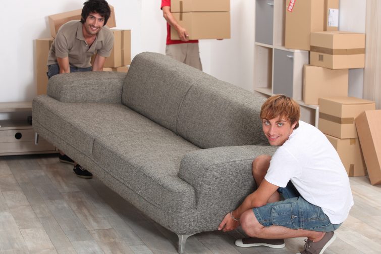 bigstock-Men-lifting-sofa-22063970